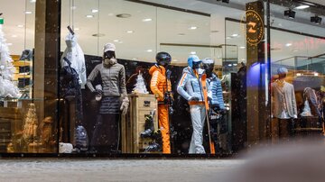 A showcase view featuring ski wear and sports clothing. The outfits are in cool colors and are suitable for winter activities.