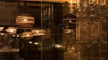 A stylish lighting with hanging lamps in a modern room. The ambiance is warm and inviting.