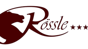 A logo with the name "Rössle" in elegant font. It features a stylized horse head silhouette and has five stars.